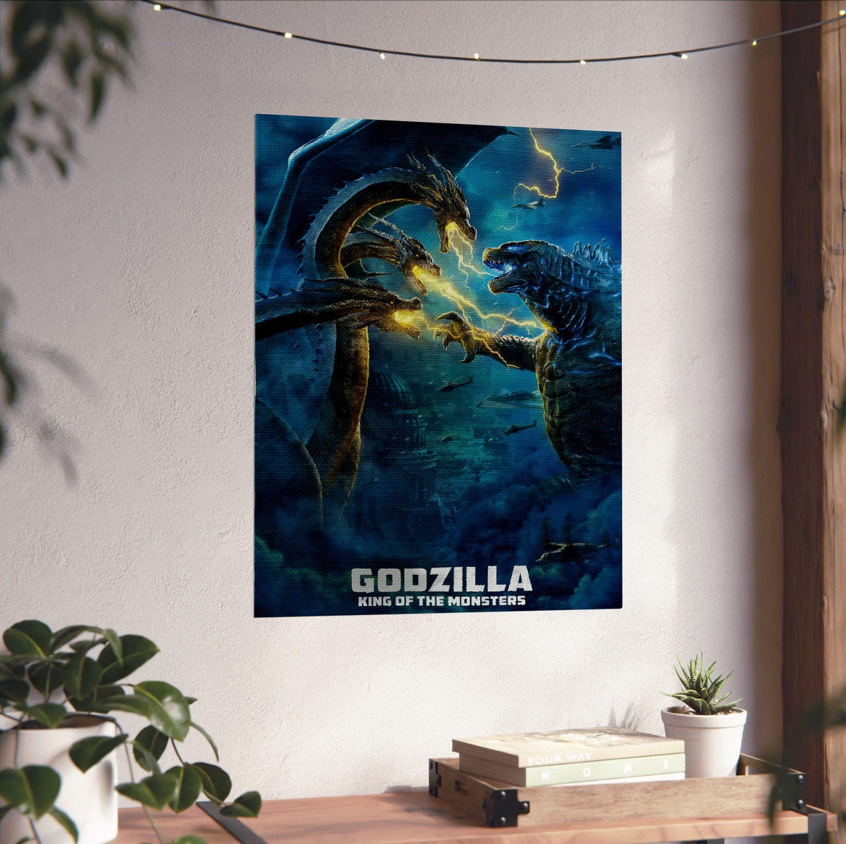 Godzilla: King of the Monsters (2019) Movie Ghidorah Battle Art poster unframed on a white wall above a desk