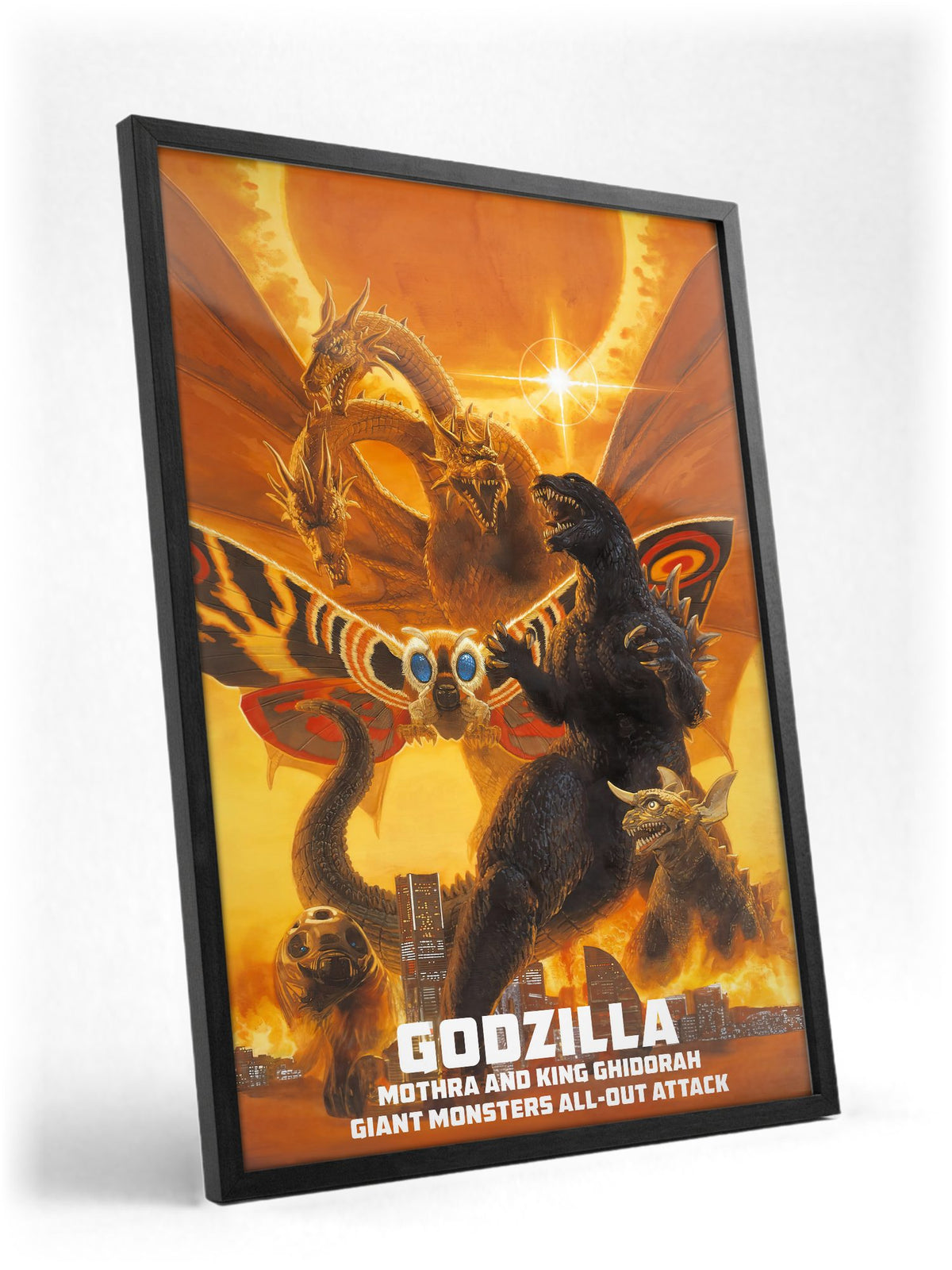 Godzilla, Mothra and King Ghidorah: Giant Monsters All-Out Attack (2001) Poster | Kaiju Wall Art Key Art poster in a black frame with glass leaning against a wall