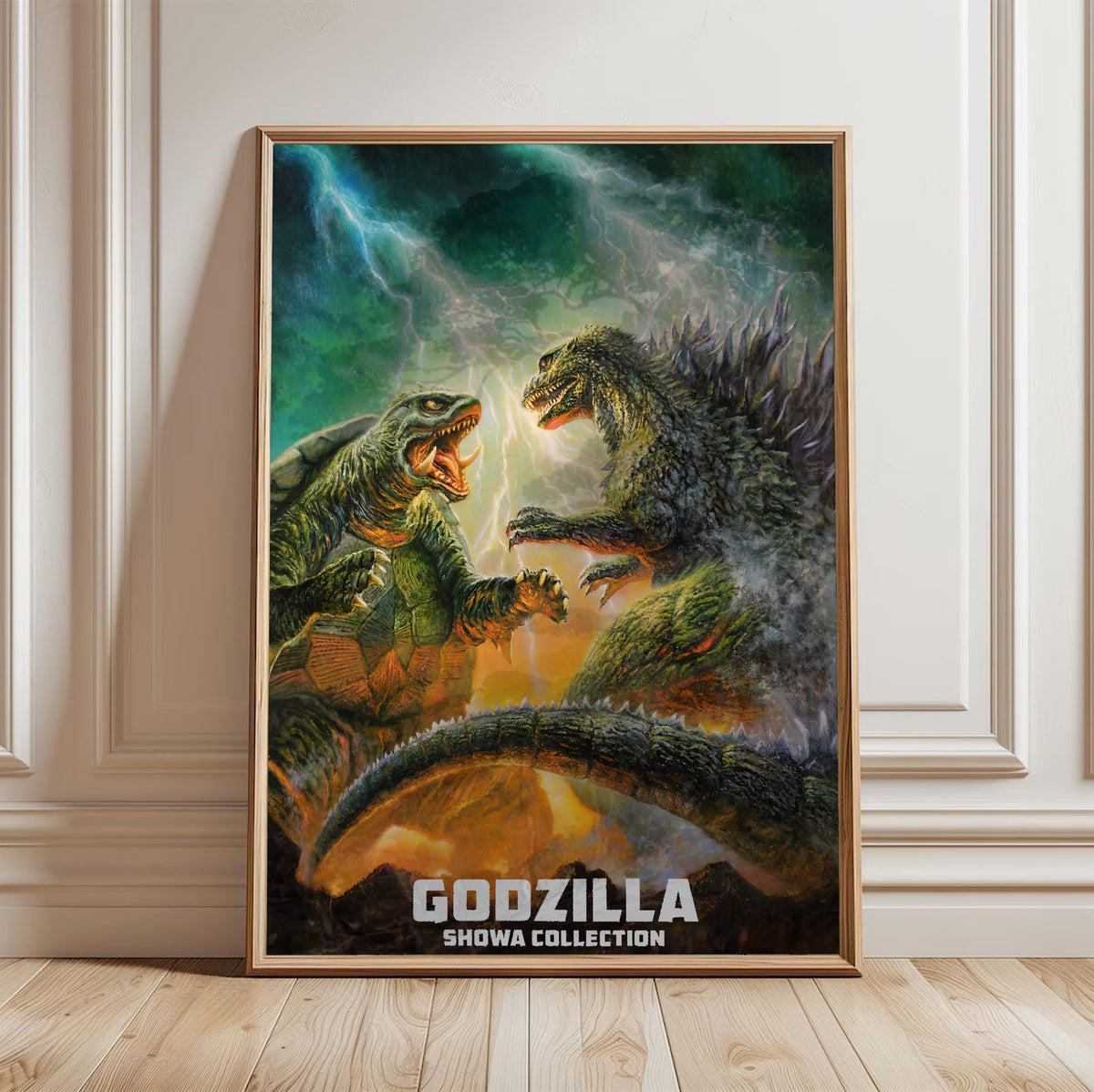 Godzilla Showa Era Movie Collection Art poster in a light oak frame leaning against a white wall