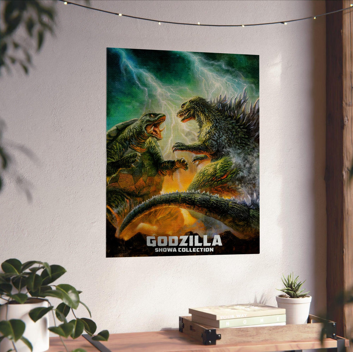 Godzilla Showa Era Movie Collection Art poster unframed on a white wall above a desk