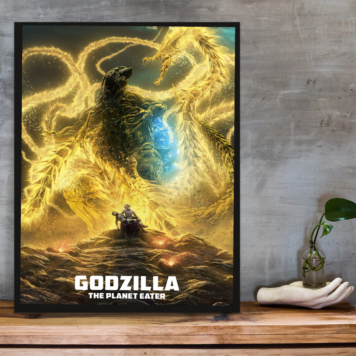 Godzilla: The Planet Eater (2018) Movie Key Art poster in a black frame on a wooden shelf against concrete