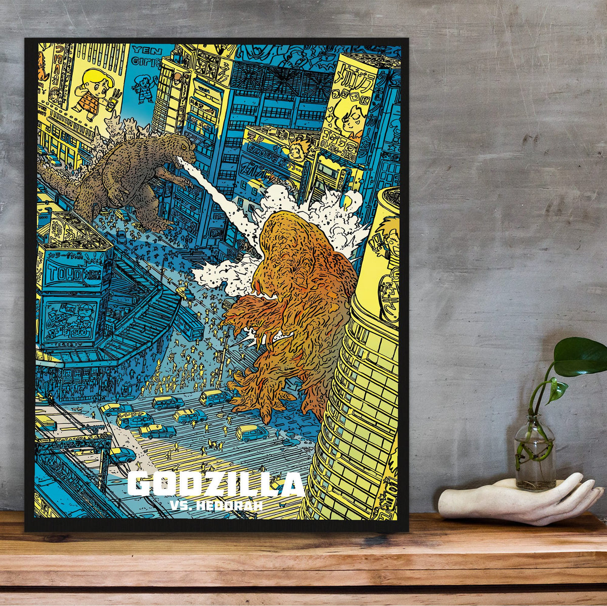 Godzilla vs. Hedorah (1971) Movie Illustrated Art poster in a black frame on a wooden shelf against concrete