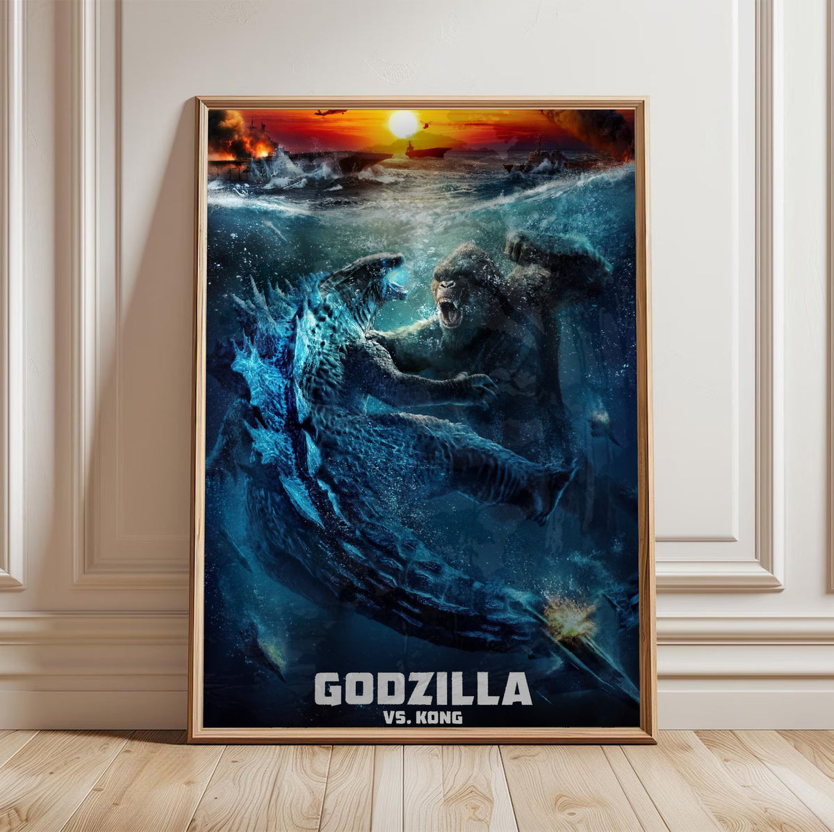 Godzilla vs. Kong (2021) Movie Ocean Battle Art poster in a light oak frame leaning against a white wall