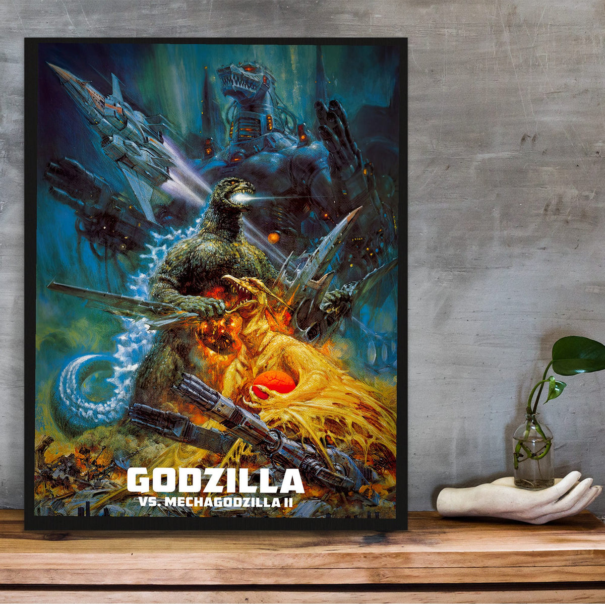 Godzilla vs. Mechagodzilla II (1993) Movie Key Art poster in a black frame on a wooden shelf against concrete