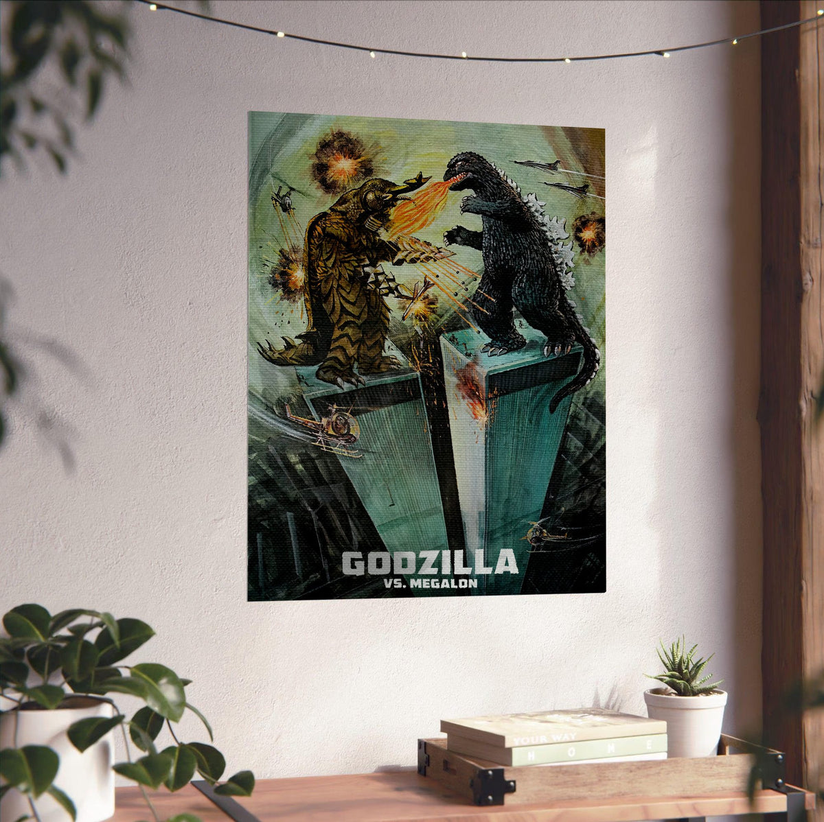 Godzilla vs. Megalon (1973) Movie Illustrated Art poster unframed on a white wall above a desk