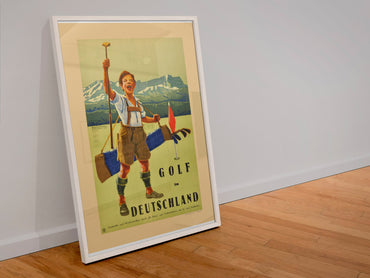 Golf in Deutschland poster in a white frame leaning against a wall