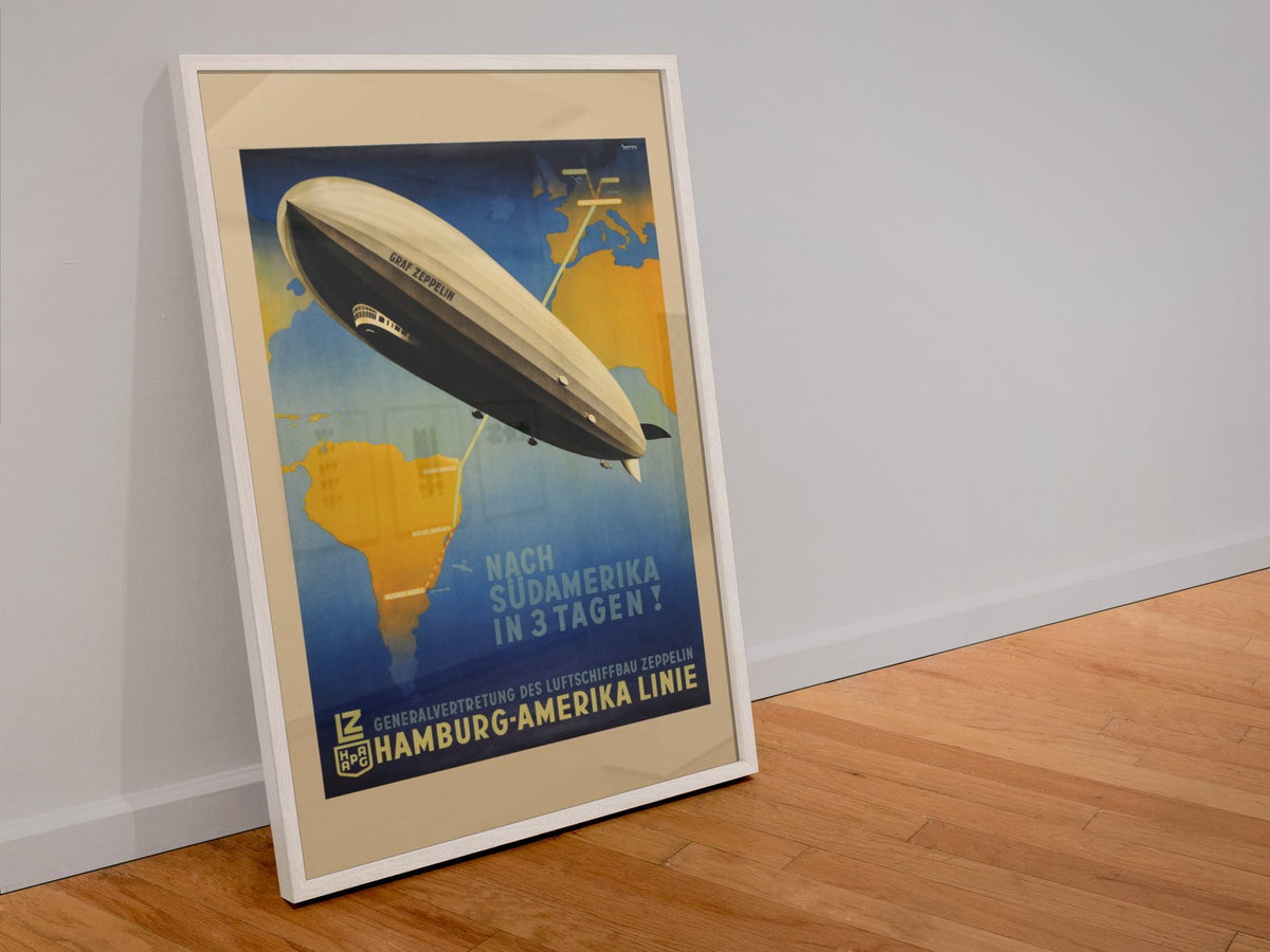 Graf Zeppelin to South America poster in a white frame leaning against a wall