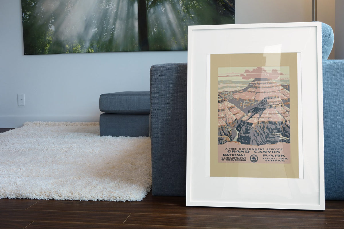 Grand Canyon National Park poster leaning beside a blue sofa