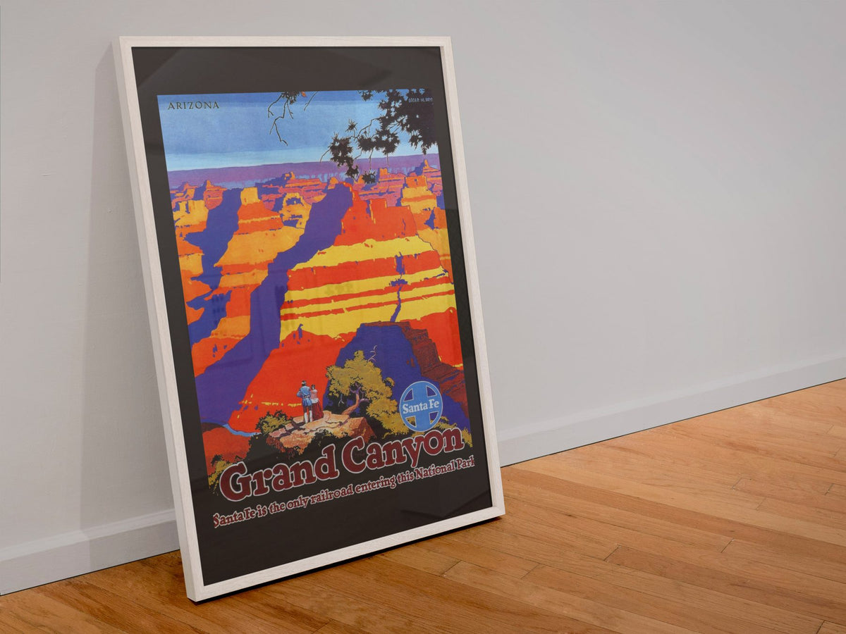 Grand Canyon Santa Fe poster in a white frame leaning against a wall