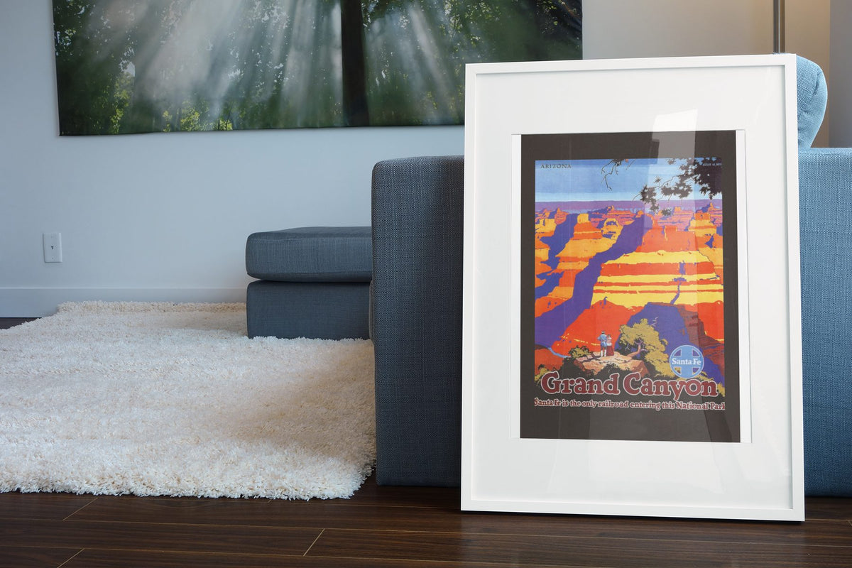 Grand Canyon Santa Fe poster leaning beside a blue sofa