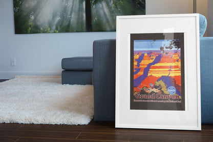 Grand Canyon Santa Fe poster leaning beside a blue sofa