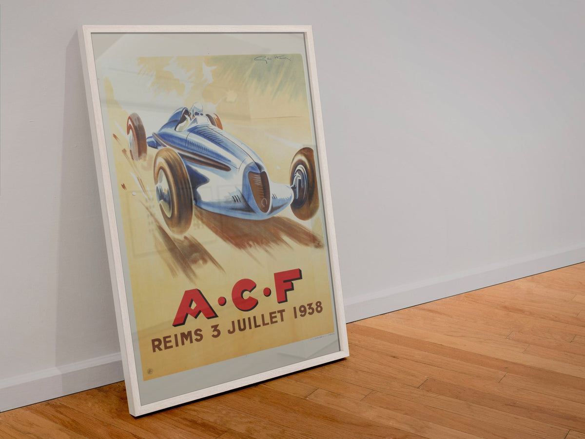 Grand Prix de l'ACF Reims 1938 poster in a white frame leaning against a wall