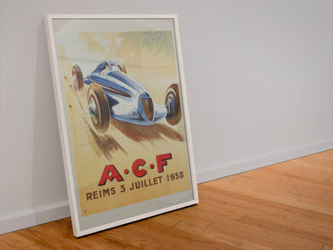 Grand Prix de l'ACF Reims 1938 poster in a white frame leaning against a wall
