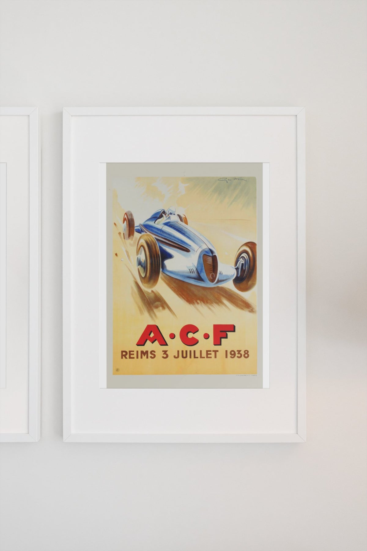 Grand Prix de l'ACF Reims 1938 poster in a white frame on a light wall