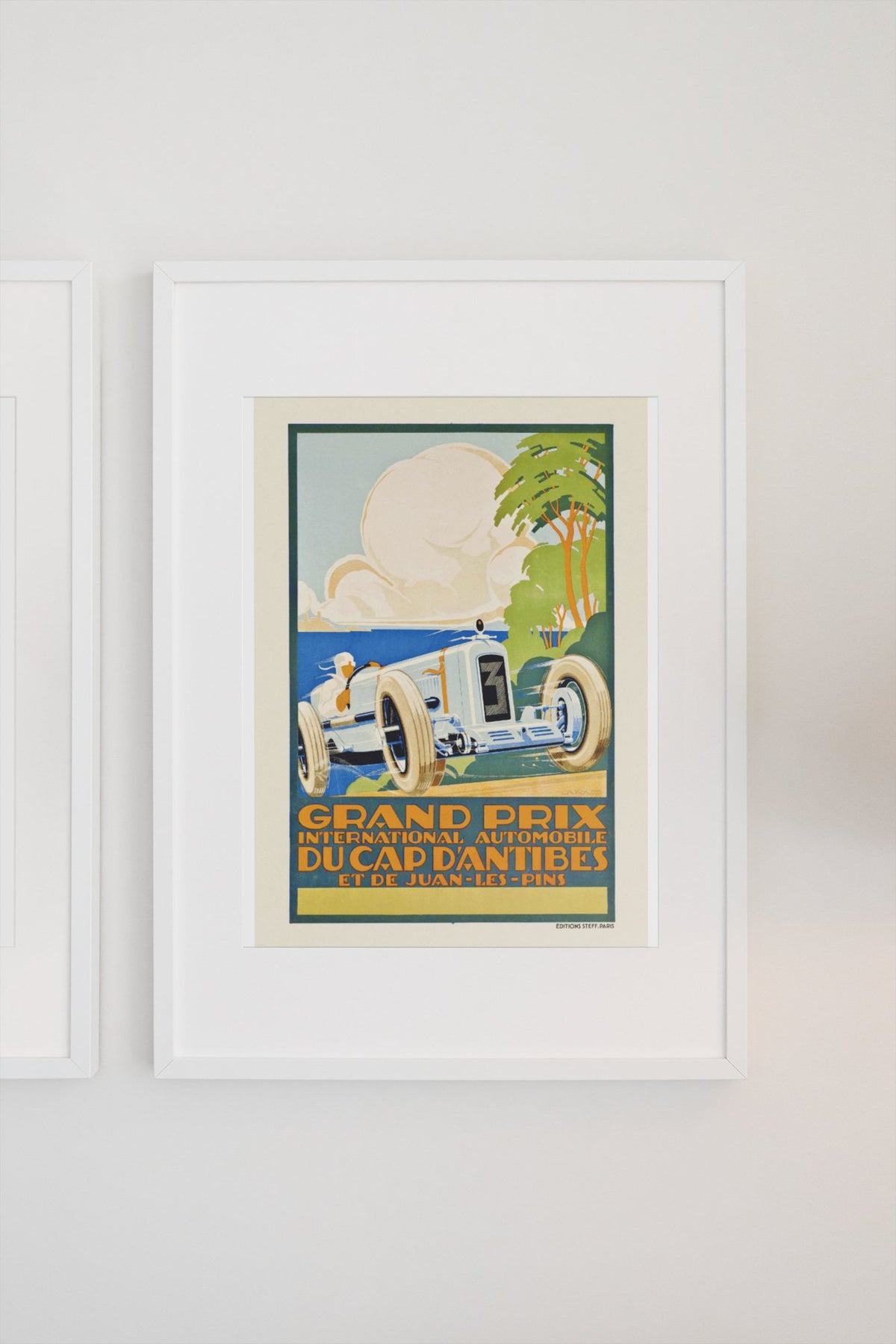Grand Prix du Cap d'Antibes et de Juan-les-Pins poster in a white frame on a light wall