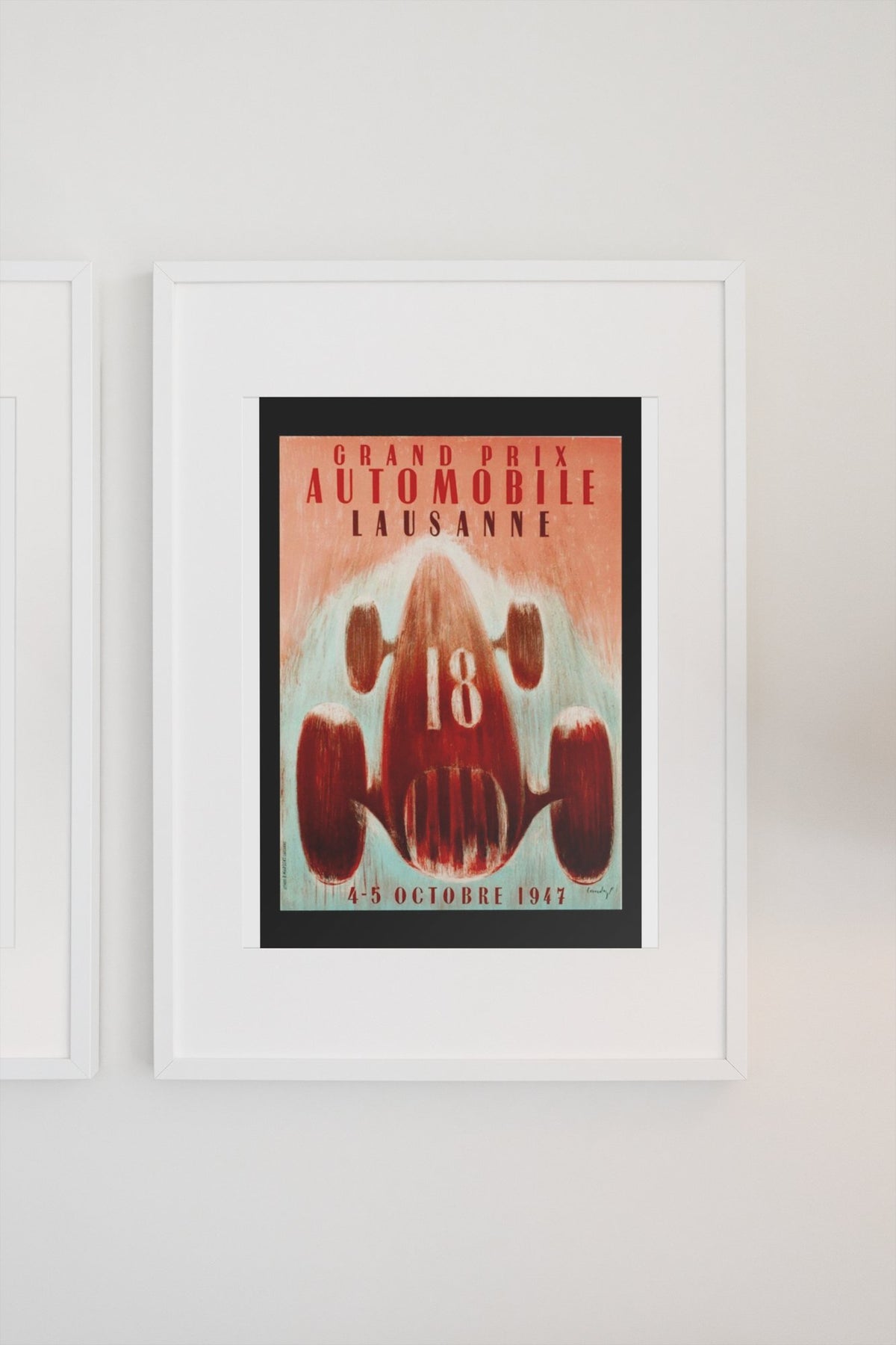 Grand Prix Lausanne 1947 poster in a white frame on a light wall