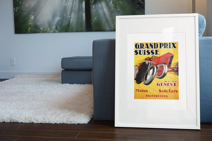 Grand Prix Suisse Genève poster in a white frame leaning beside a blue sofa
