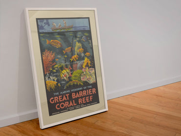 Great Barrier Coral Reef 1930s poster in a white frame leaning against a wall