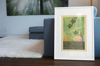 Great Barrier Reef Queensland poster leaning beside a blue sofa