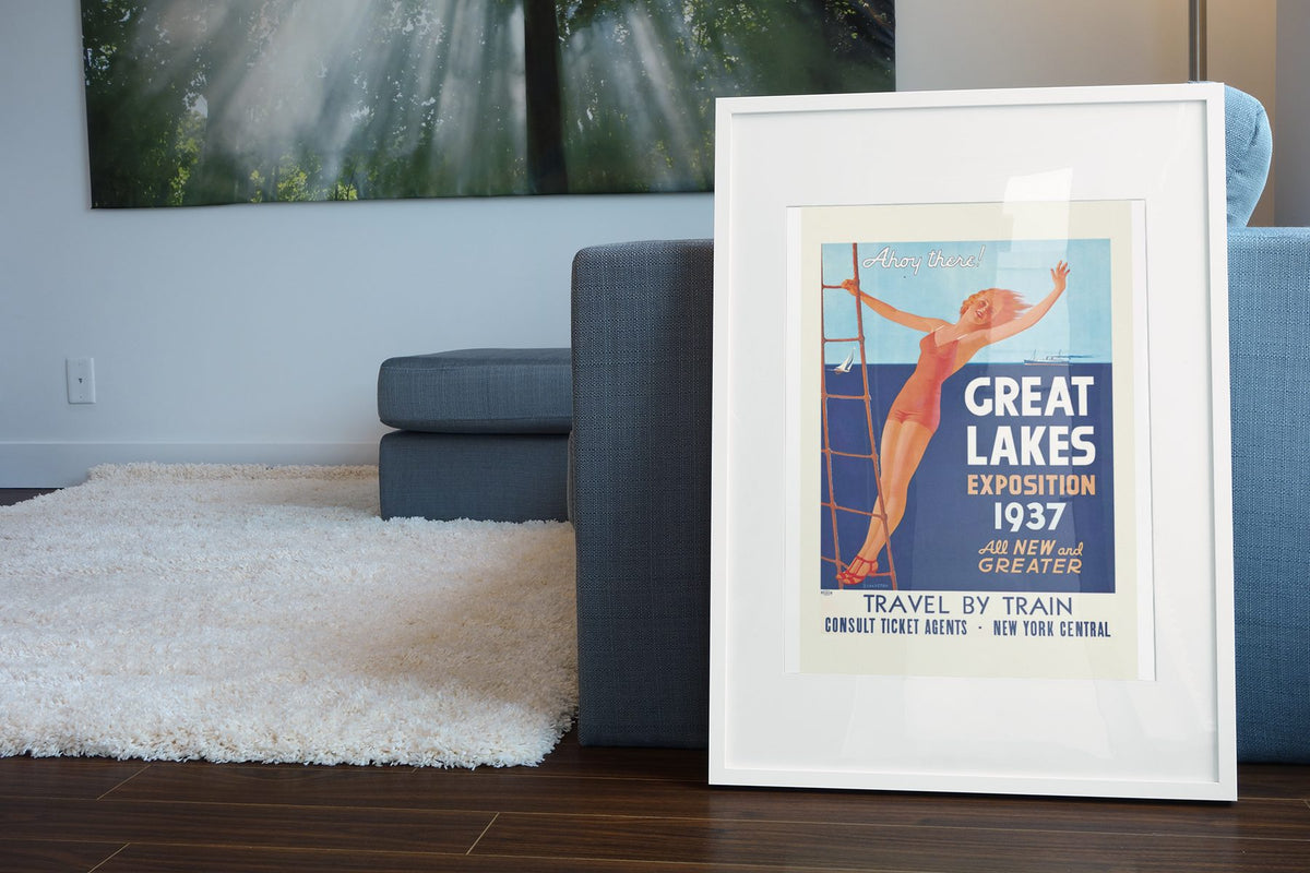 Great Lakes Exposition Cleveland 1937 poster leaning beside a blue sofa