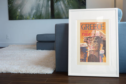 Greece Fly TWA 1960s poster leaning beside a blue sofa
