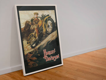 Harley-Davidson 1920s poster in a white frame leaning against a wall