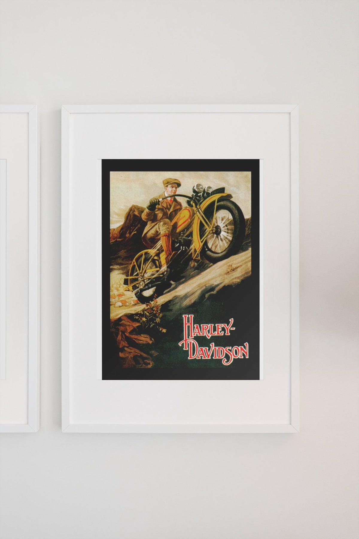 Harley-Davidson 1920s poster in a white frame on a light wall