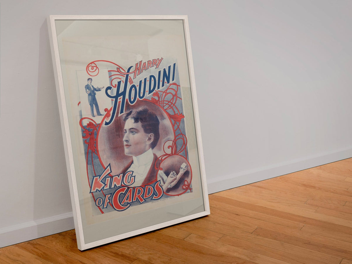 Harry Houdini King of Cards poster in a white frame leaning against a wall