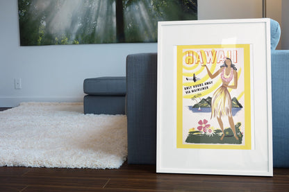 Hawaii via Mainliner poster leaning beside a blue sofa