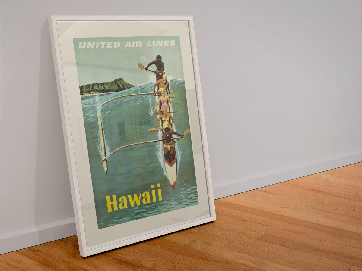 Hawaii Outrigger Canoe poster in a white frame leaning against a wall