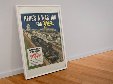 Heres a War Job for You Railroad Workers poster in a white frame leaning against a wall