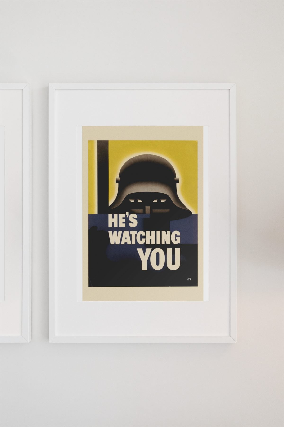 Hes Watching You poster on a light wall