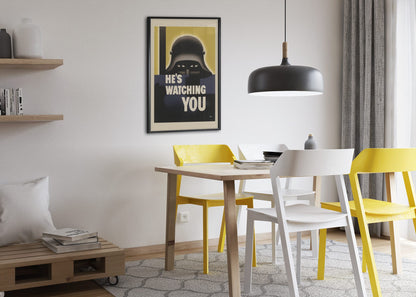 Hes Watching You poster framed above a dining table