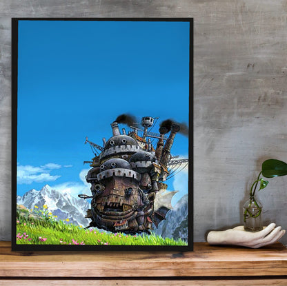 Howl's Moving Castle Triptych Panel Art poster in a black frame on a wooden shelf against concrete