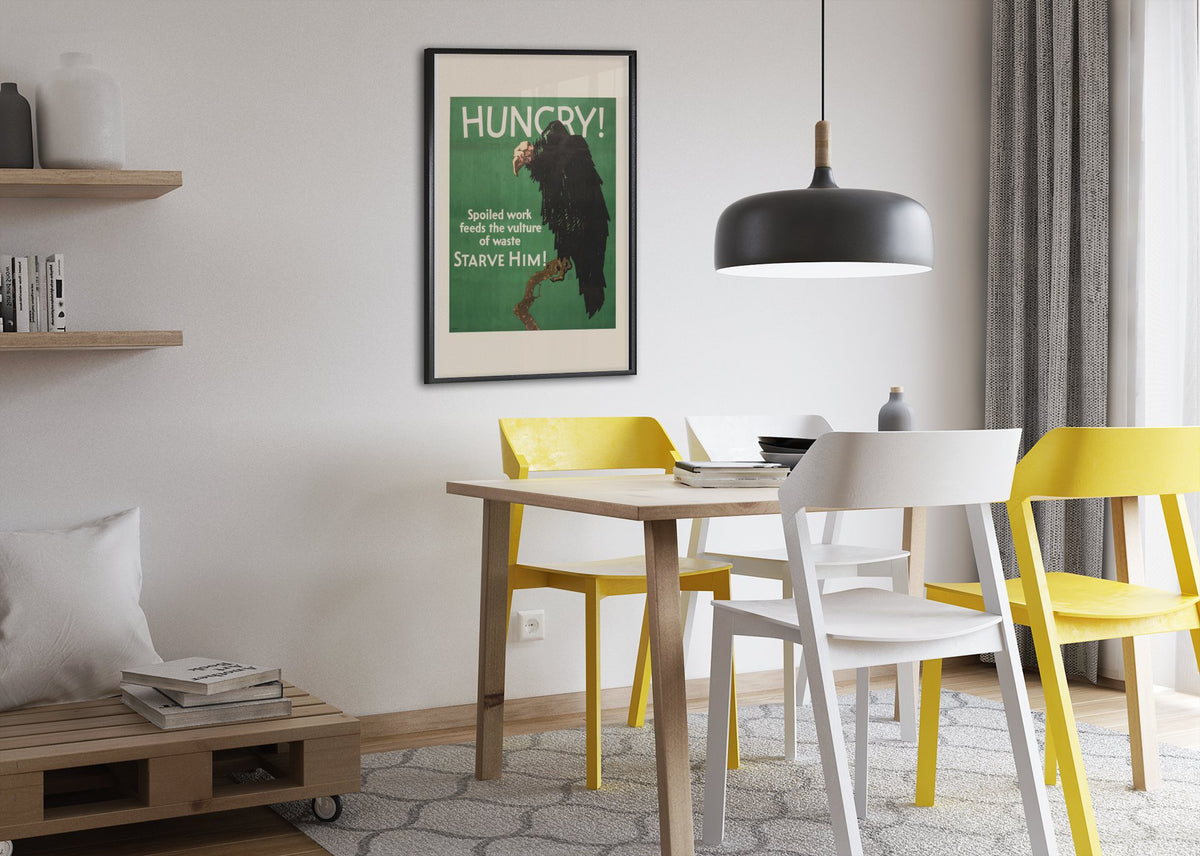 Hungry poster framed above a dining table