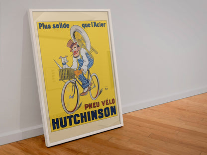 Hutchinson Pneu Velo poster in a white frame leaning against a wall