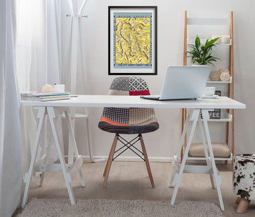 Hysterical Map of Death Valley 1940s print framed above a white desk in a home office