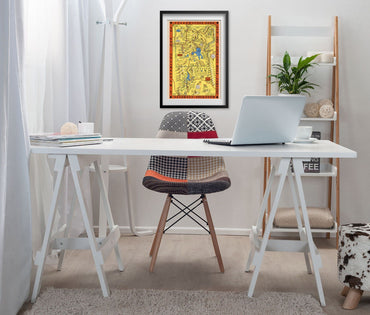 Hysterical Map of Yellowstone 1936 print framed above a white desk in a home office