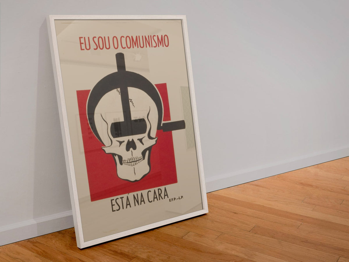 I Am Communism poster in a white frame leaning against a wall