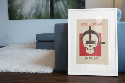 I Am Communism poster leaning beside a blue sofa