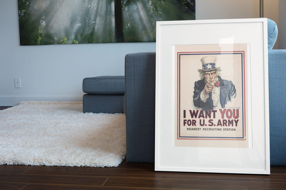 I Want You Uncle Sam poster leaning beside a blue sofa