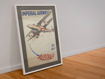 Imperial Airways Australia poster in a white frame leaning against a wall