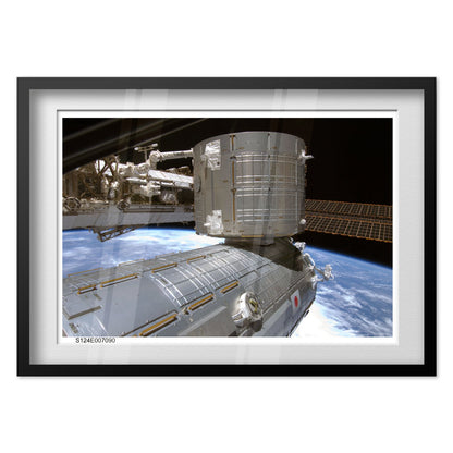 International Space Station over Earth poster in a black frame