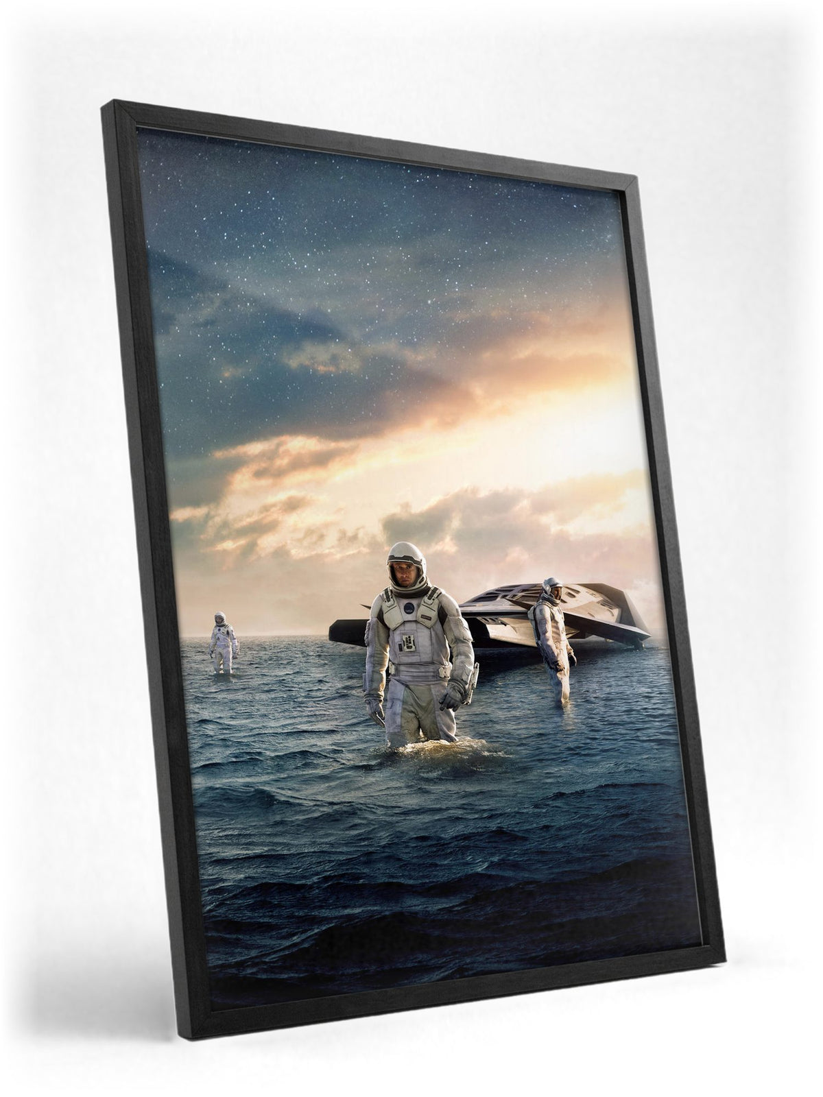 Interstellar (2014) Movie Water Planet Art poster in a black frame with glass leaning against a wall