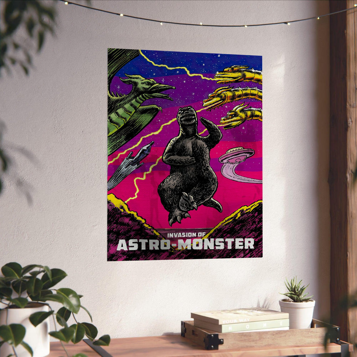 Invasion of Astro-Monster (1965) Movie Illustrated Art poster unframed on a white wall above a desk