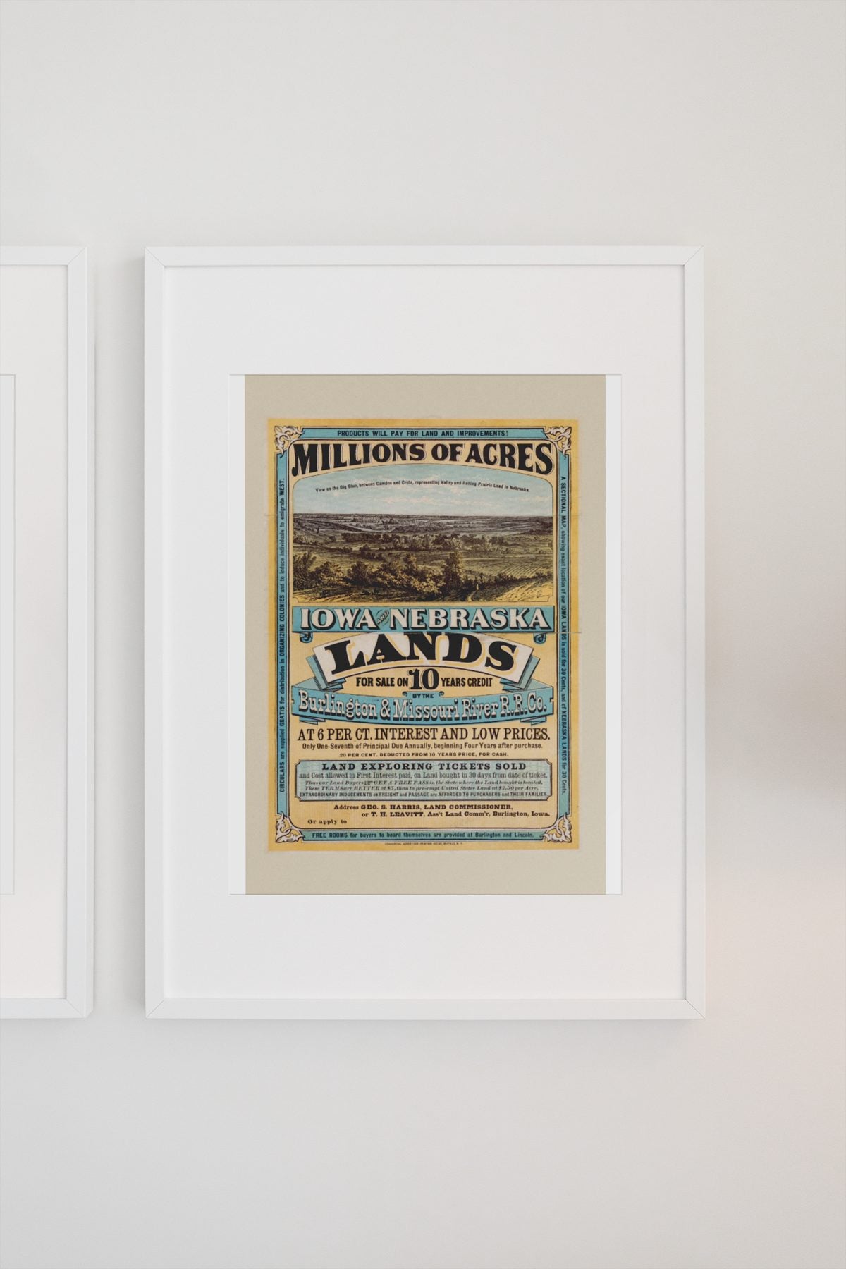 Iowa and Nebraska Lands for Sale poster on a light wall