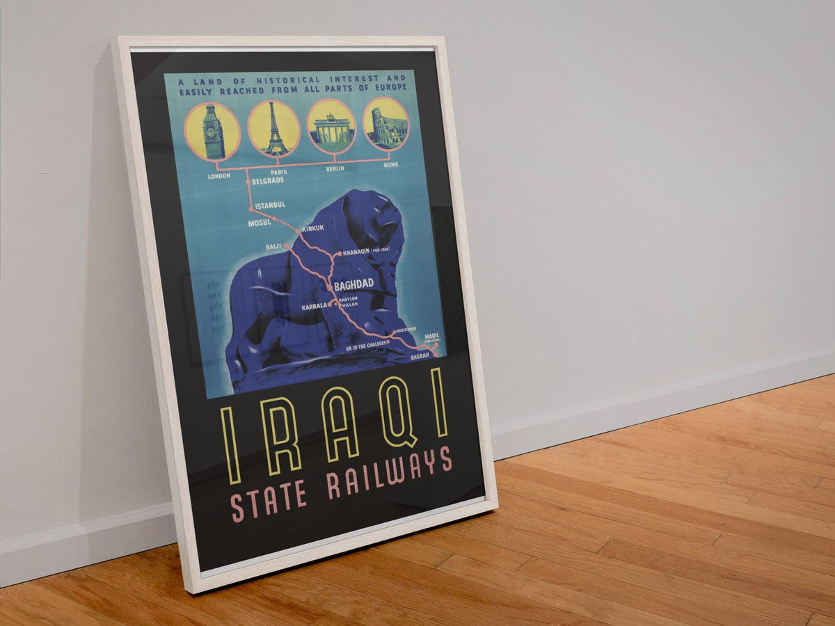 Iraqi State Railways poster in a white frame leaning against a wall