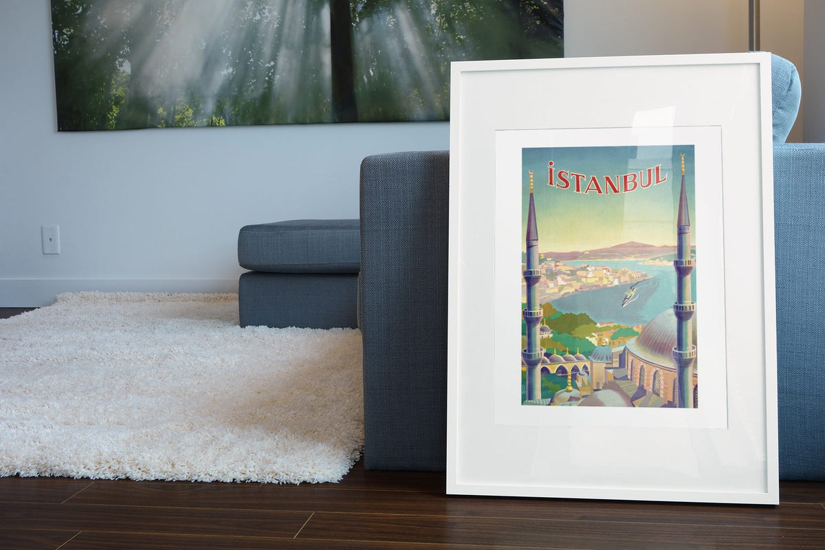 Istanbul poster leaning beside a blue sofa