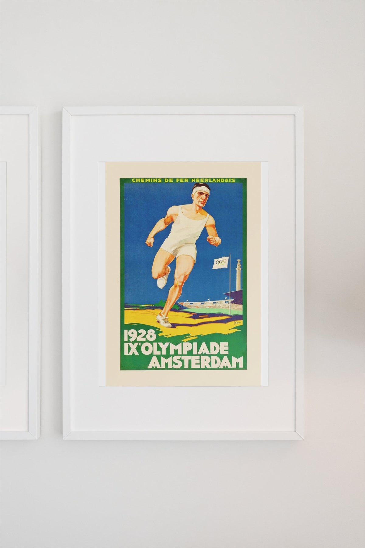 Amsterdam Olympics 1928 poster on a light wall