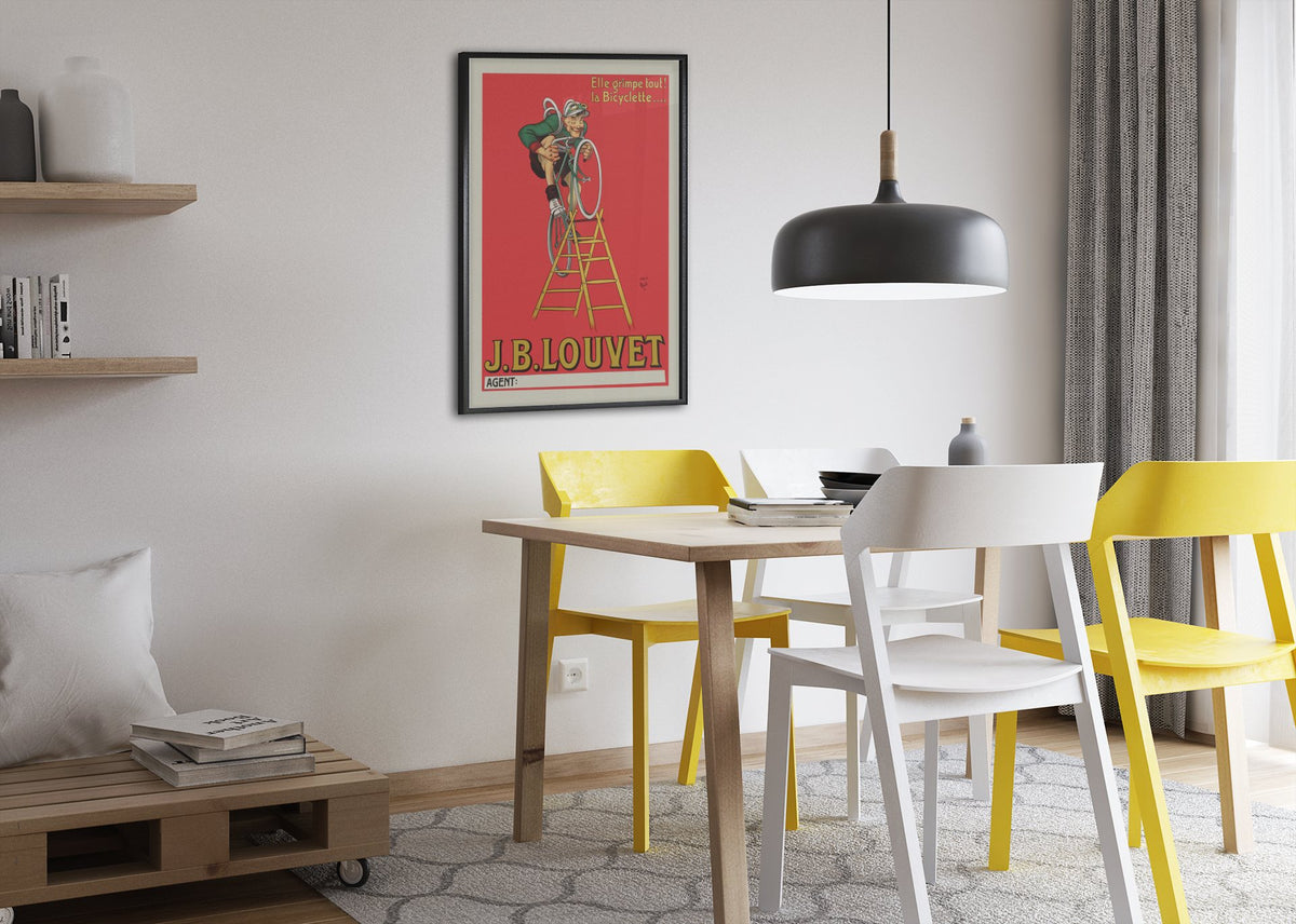 JB Louvet Bicycle on a Ladder poster framed above a dining table
